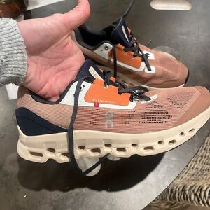 On Running Sneakers with Brown and Orange Accents